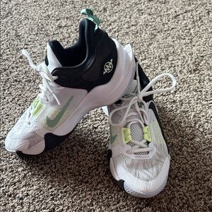 Nike Kids' White and Black Basketball Sneakers with Green Accents